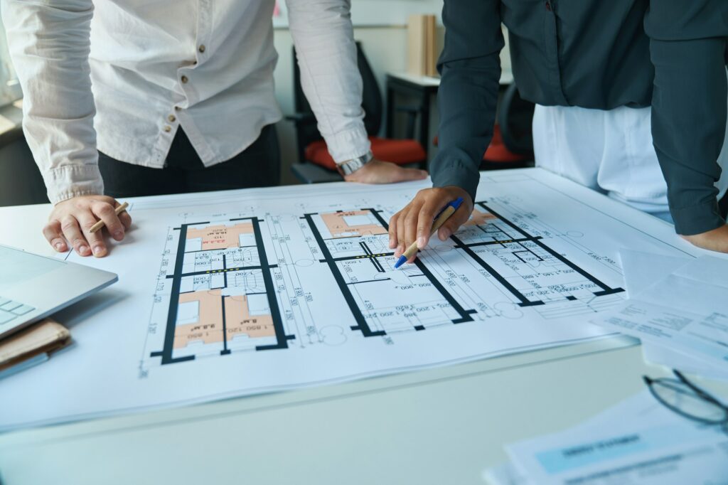 Top 6 Real Estate Investment Strategies for 2024: Expert Insights 2 working on a project for a new house